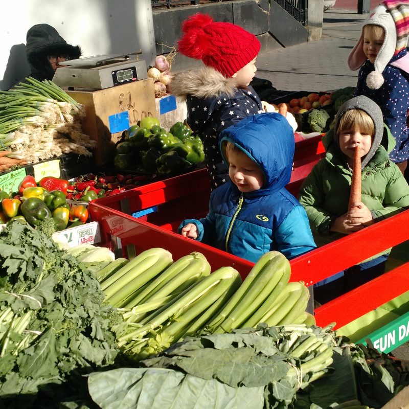 children with vegetable cart